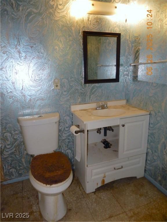 3175 Palmdale St, Las Vegas, NV 89121 - bathroom featuring wallpapered walls and vanity