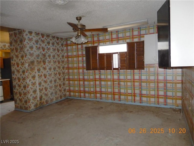 3175 Palmdale St, Las Vegas, NV 89121 - garage with ceiling fan and wallpapered walls