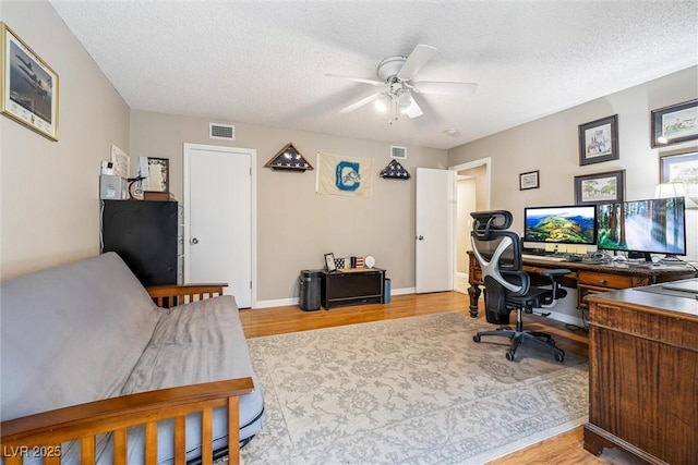 3930 Maranatha Cir, Las Vegas, NV 89103 - office featuring ceiling fan, a textured ceiling, and light wood-style floors