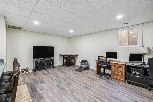 3930 Maranatha Cir, Las Vegas, NV 89103 - office area with wood finished floors, a paneled ceiling, and concrete block wall