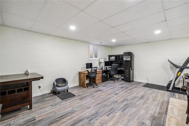 3930 Maranatha Cir, Las Vegas, NV 89103 - office space featuring wood finished floors, concrete block wall, and a paneled ceiling