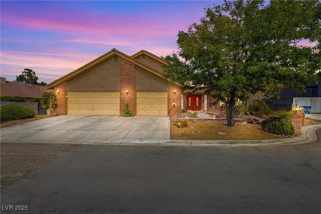 3930 Maranatha Cir, Las Vegas, NV 89103 - view of front of property featuring driveway, an attached garage, and stucco siding