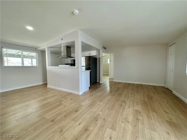 604 N Minnesota St, Las Vegas, NV 89107 - unfurnished living room featuring light wood finished floors and recessed lighting