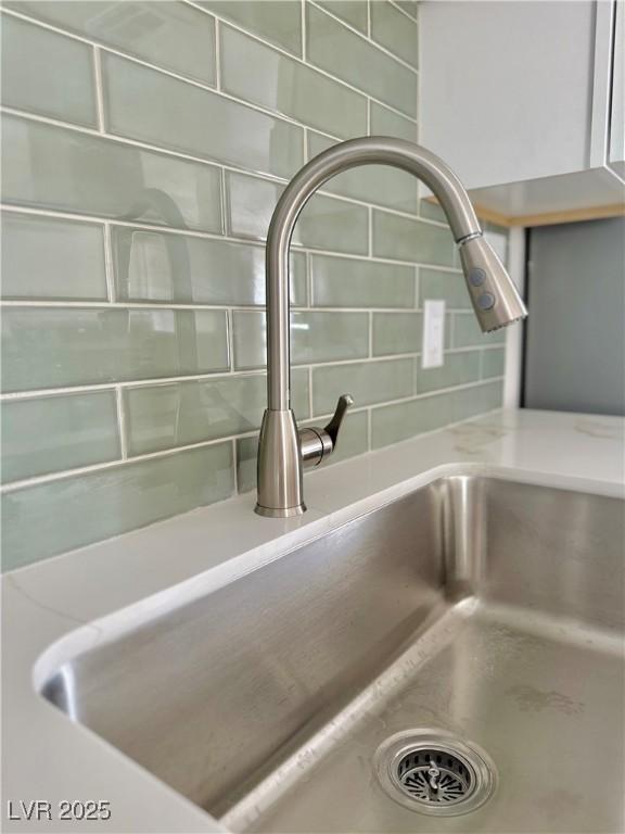 604 N Minnesota St, Las Vegas, NV 89107 - kitchen view of a sink and decorative backsplash