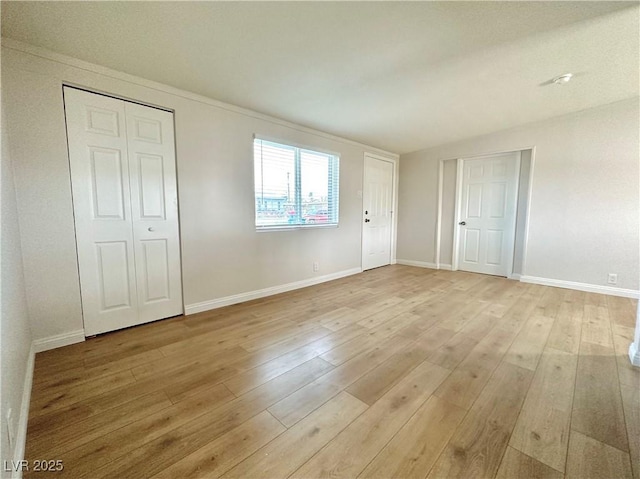 604 N Minnesota St, Las Vegas, NV 89107 - unfurnished bedroom with light wood-style floors and baseboards