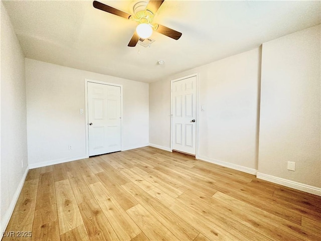 604 N Minnesota St, Las Vegas, NV 89107 - unfurnished bedroom with light wood-type flooring and ceiling fan