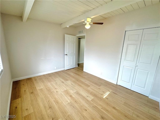 604 N Minnesota St, Las Vegas, NV 89107 - unfurnished bedroom featuring beamed ceiling, light wood-style floors, a closet, and ceiling fan