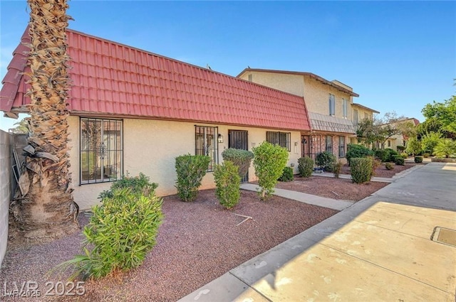 3907 Torsby Pl, Las Vegas, NV 89119 - multi unit property with stucco siding and a tile roof