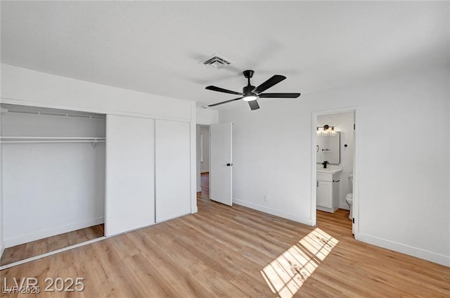 3907 Torsby Pl, Las Vegas, NV 89119 - unfurnished bedroom featuring a closet, light wood-style floors, ceiling fan, and ensuite bath