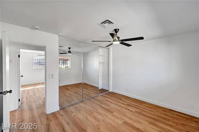3907 Torsby Pl, Las Vegas, NV 89119 - unfurnished bedroom featuring light wood-style flooring, a ceiling fan, and a closet