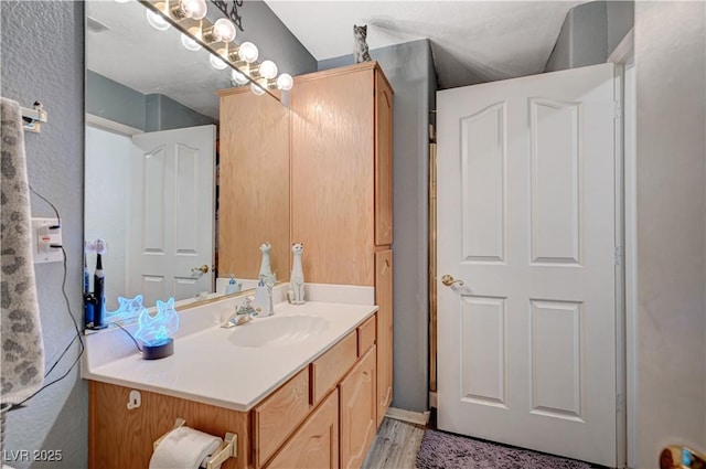 700 Capri Dr Unit 27B, Boulder City, NV 89005 - bathroom featuring vanity and wood finished floors