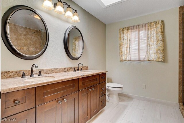 2851 S Valley View Blvd Unit 1039, Las Vegas, NV 89102 - bathroom with double vanity and toilet