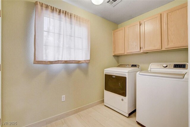 2851 S Valley View Blvd Unit 1039, Las Vegas, NV 89102 - laundry area with washing machine and clothes dryer and cabinet space