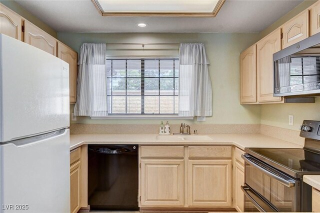 2851 S Valley View Blvd Unit 1039, Las Vegas, NV 89102 - kitchen featuring freestanding refrigerator, black dishwasher, range with two ovens, light brown cabinets, and recessed lighting