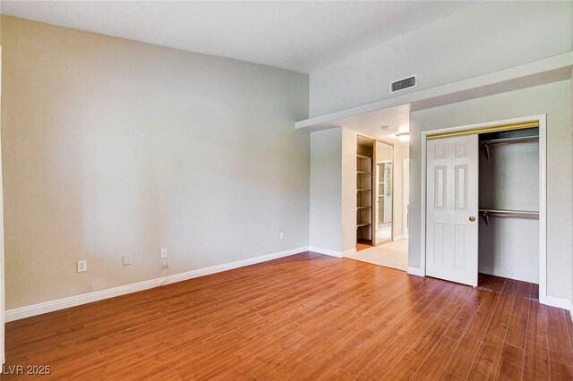 2851 S Valley View Blvd Unit 1039, Las Vegas, NV 89102 - unfurnished bedroom featuring wood finished floors and a closet
