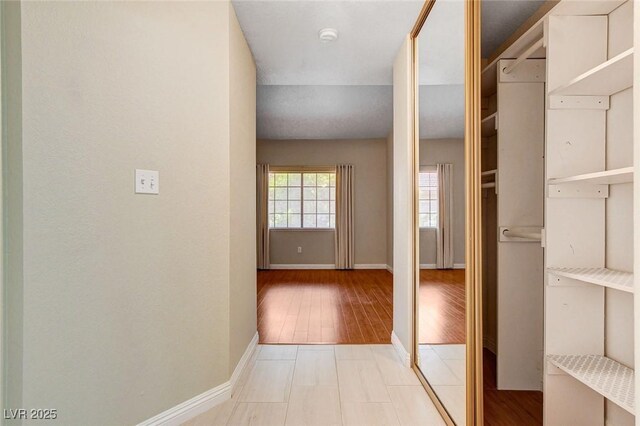 2851 S Valley View Blvd Unit 1039, Las Vegas, NV 89102 - corridor with baseboards and wood finished floors