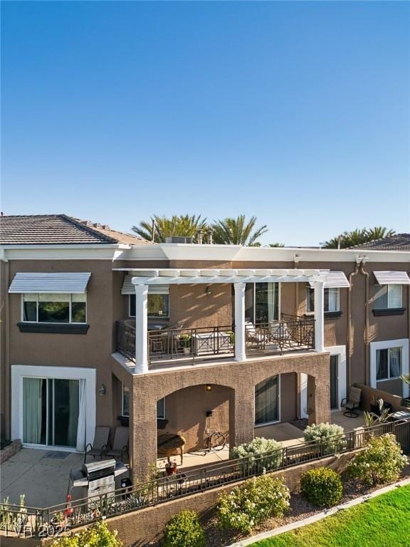 9430 Laguna Niguel Dr Unit 203, Las Vegas, NV 89134 - back of property featuring a balcony and stucco siding