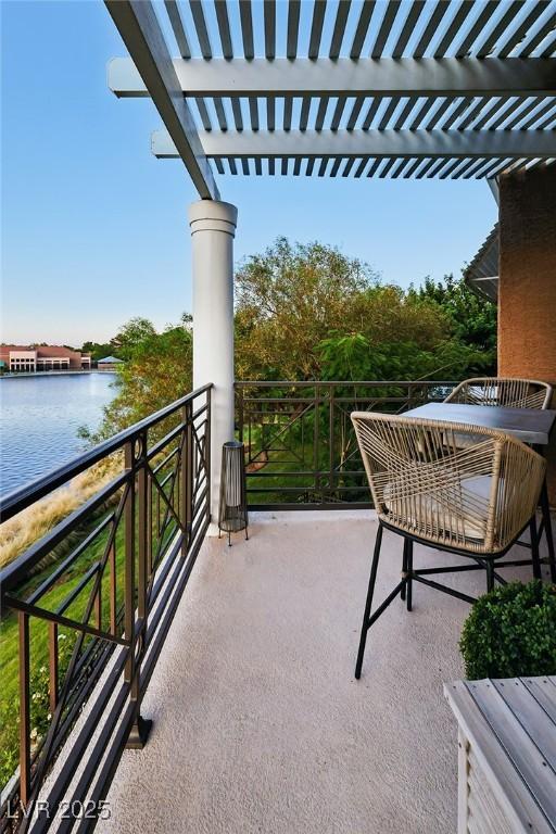 9430 Laguna Niguel Dr Unit 203, Las Vegas, NV 89134 - balcony with a water view and a pergola