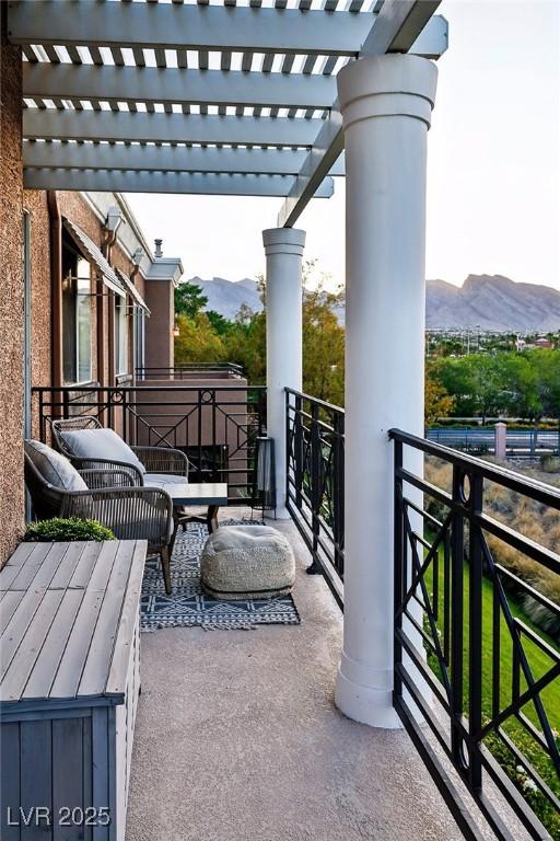 9430 Laguna Niguel Dr Unit 203, Las Vegas, NV 89134 - balcony with a mountain view and a pergola