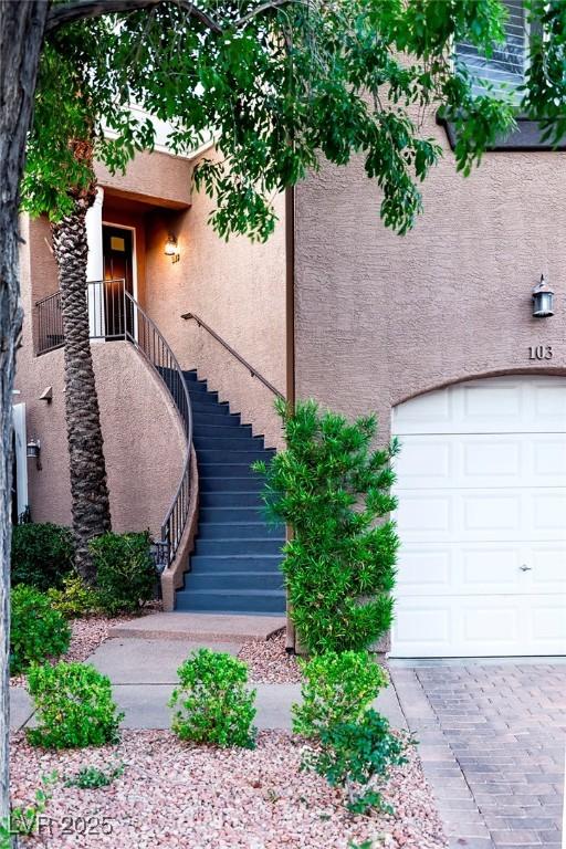 9430 Laguna Niguel Dr Unit 203, Las Vegas, NV 89134 - property entrance featuring stucco siding and an attached garage