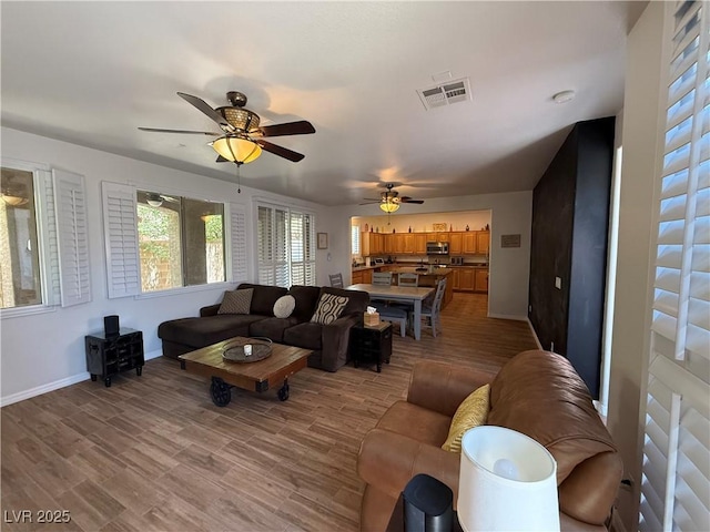 1146 Olivia Pkwy, Henderson, NV 89011 - living area featuring a ceiling fan and wood finished floors