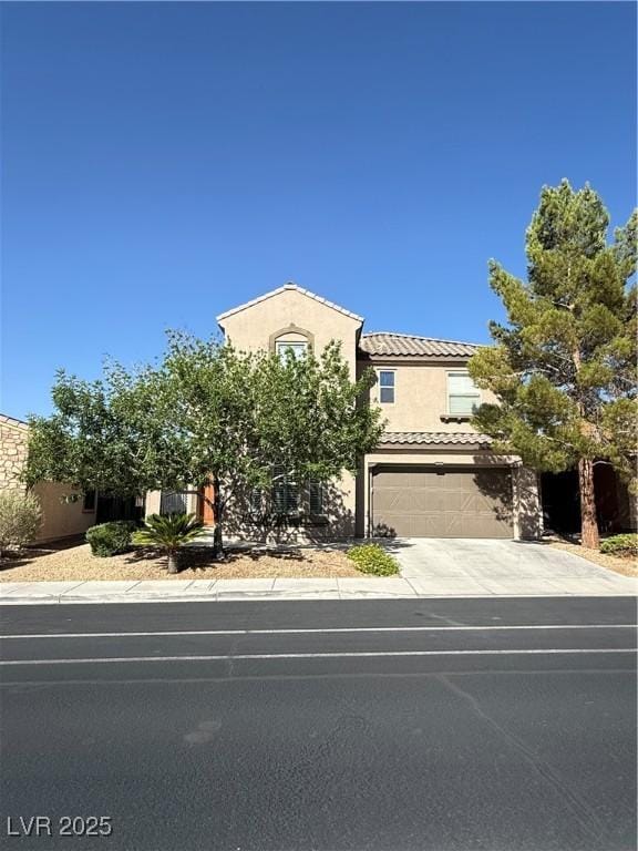 1146 Olivia Pkwy, Henderson, NV 89011 - view of front of property featuring concrete driveway, stucco siding, a garage, and a tiled roof