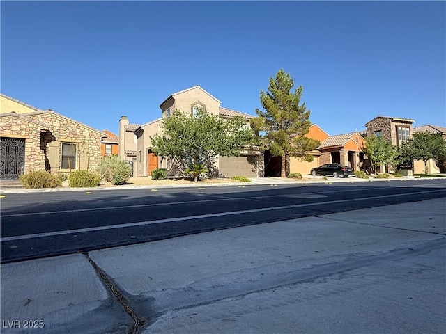 1146 Olivia Pkwy, Henderson, NV 89011 - view of asphalt street with sidewalks, a residential view, and curbs