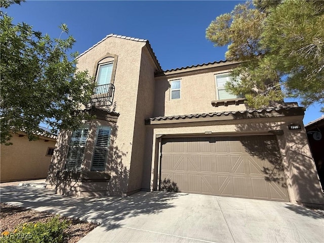 1146 Olivia Pkwy, Henderson, NV 89011 - view of front of home featuring stucco siding, an attached garage, a tiled roof, concrete driveway, and a balcony