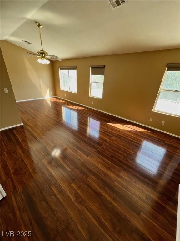 2140 Desert Peak Rd, Las Vegas, NV 89134 - spare room featuring dark wood-style floors, ceiling fan, and vaulted ceiling