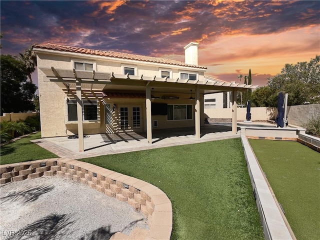 2140 Desert Peak Rd, Las Vegas, NV 89134 - rear view of house featuring a chimney, stucco siding, french doors, a pergola, and a patio