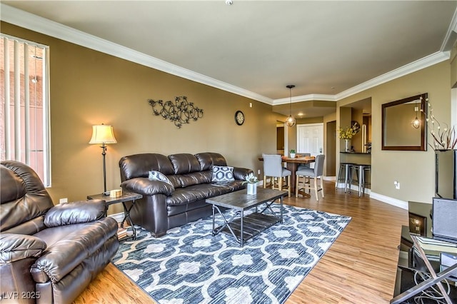 220 E Flamingo Rd Unit 317, Las Vegas, NV 89169 - living area featuring wood finished floors and crown molding