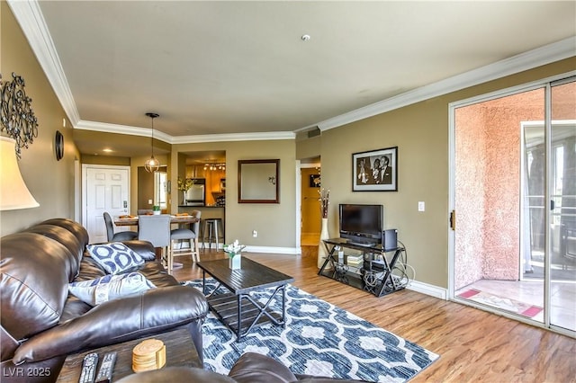220 E Flamingo Rd Unit 317, Las Vegas, NV 89169 - living room featuring wood finished floors and ornamental molding