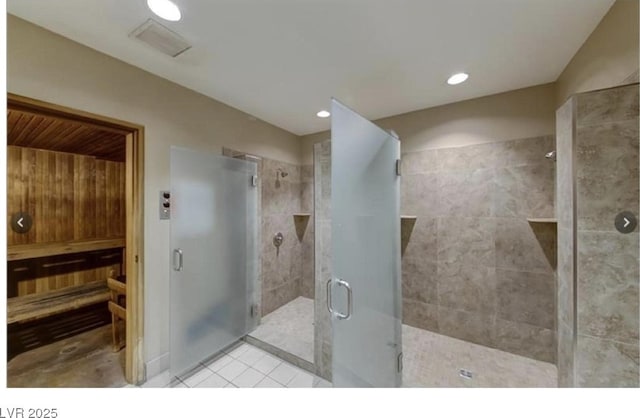 220 E Flamingo Rd Unit 317, Las Vegas, NV 89169 - bathroom featuring a shower stall, tile patterned flooring, and recessed lighting
