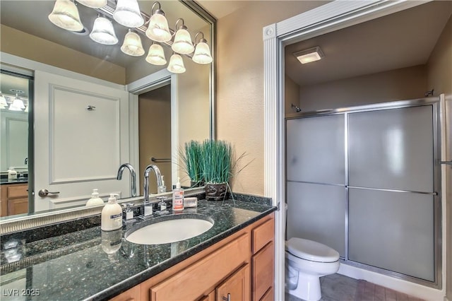 220 E Flamingo Rd Unit 317, Las Vegas, NV 89169 - bathroom with vanity, a stall shower, and a chandelier