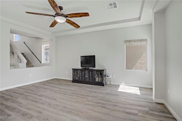 9784 Kodiak Island Ct, Las Vegas, NV 89141 - unfurnished living room with stairs, ceiling fan, and wood finished floors