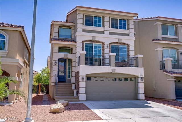 9784 Kodiak Island Ct, Las Vegas, NV 89141 - view of front of home with stucco siding, concrete driveway, a garage, and a tiled roof
