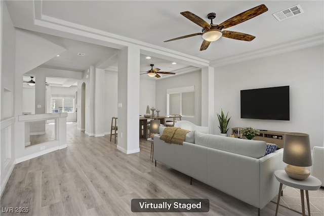 9784 Kodiak Island Ct, Las Vegas, NV 89141 - living room featuring ceiling fan, light wood-style flooring, recessed lighting, and arched walkways