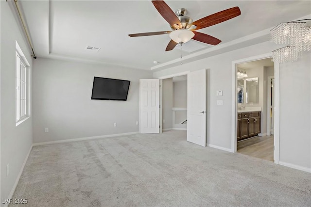 9784 Kodiak Island Ct, Las Vegas, NV 89141 - unfurnished bedroom featuring light colored carpet, a chandelier, ensuite bathroom, and a ceiling fan