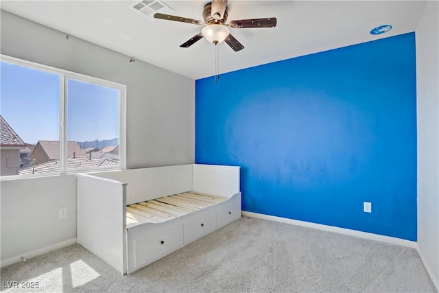 9784 Kodiak Island Ct, Las Vegas, NV 89141 - unfurnished bedroom featuring carpet flooring and a ceiling fan