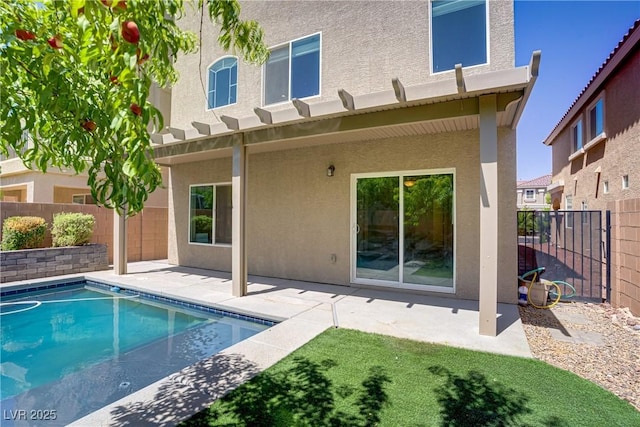 9784 Kodiak Island Ct, Las Vegas, NV 89141 - back of property with stucco siding, a patio area, and a fenced backyard