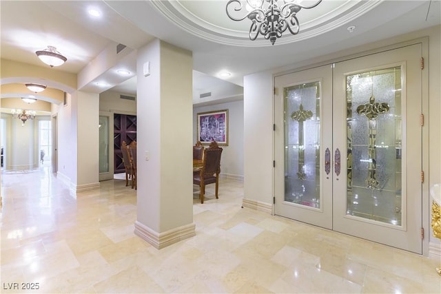 9101 Alta Dr Unit 301, Las Vegas, NV 89145 - foyer with a chandelier, french doors, arched walkways, and recessed lighting