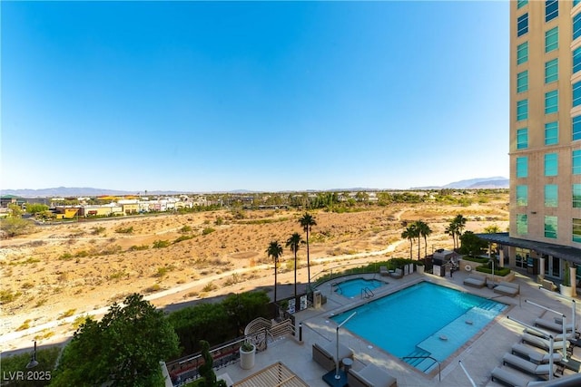 9101 Alta Dr Unit 301, Las Vegas, NV 89145 - community pool with a mountain view, a community hot tub, a patio, and view of desert