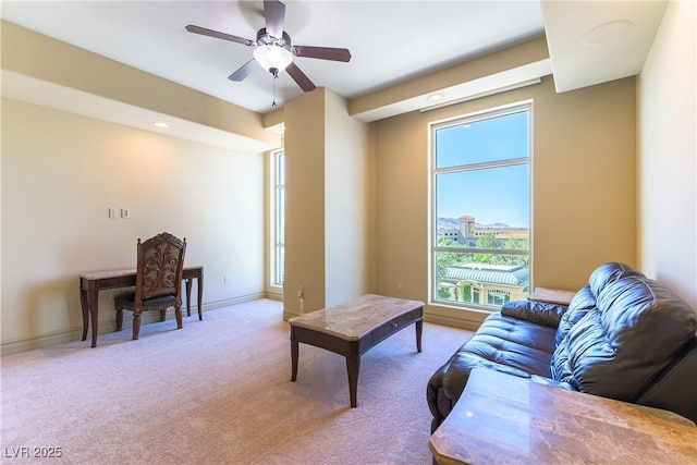 9101 Alta Dr Unit 301, Las Vegas, NV 89145 - carpeted living area featuring a ceiling fan and baseboards