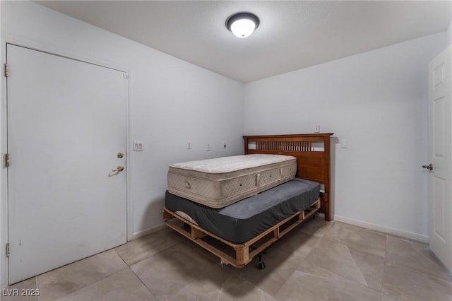 7720 W Agate Ave, Las Vegas, NV 89113 - bedroom featuring tile patterned flooring and baseboards