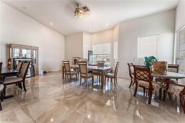 7720 W Agate Ave, Las Vegas, NV 89113 - dining space featuring a high ceiling, light marble finish flooring, and recessed lighting