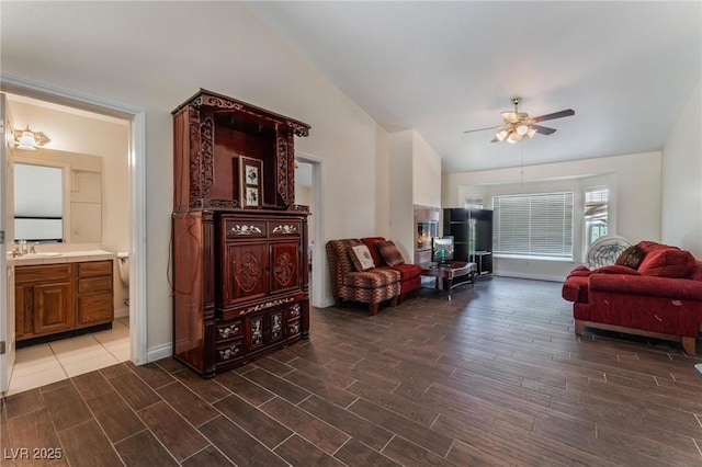 7720 W Agate Ave, Las Vegas, NV 89113 - living room featuring wood finish floors, ceiling fan, and vaulted ceiling
