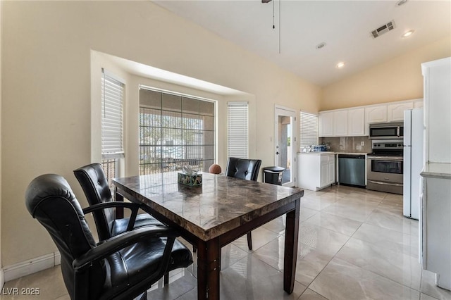 7720 W Agate Ave, Las Vegas, NV 89113 - dining room with vaulted ceiling and light tile patterned floors