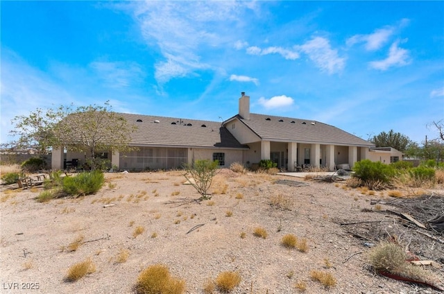 7720 W Agate Ave, Las Vegas, NV 89113 - back of property with a chimney, a tile roof, and stucco siding