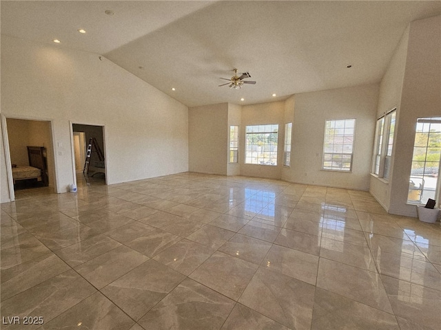 7720 W Agate Ave, Las Vegas, NV 89113 - empty room with light marble finish flooring, ceiling fan, high vaulted ceiling, and recessed lighting
