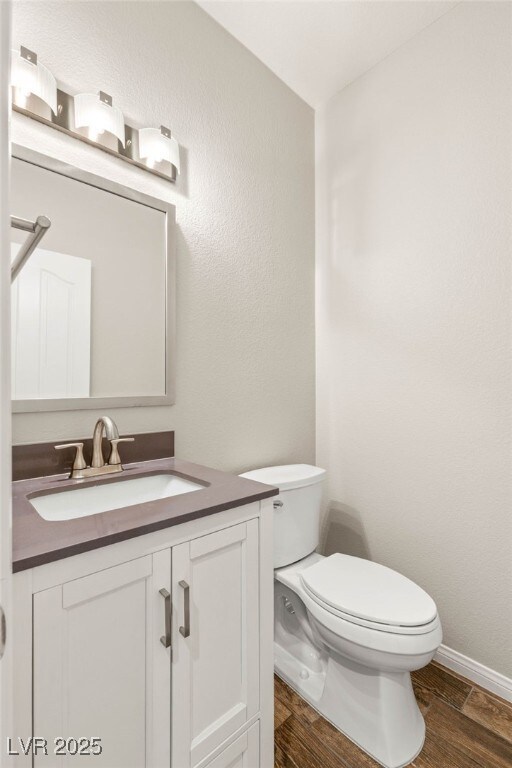251 Big Horn Dr, Boulder City, NV 89005 - half bath with vanity and wood finished floors